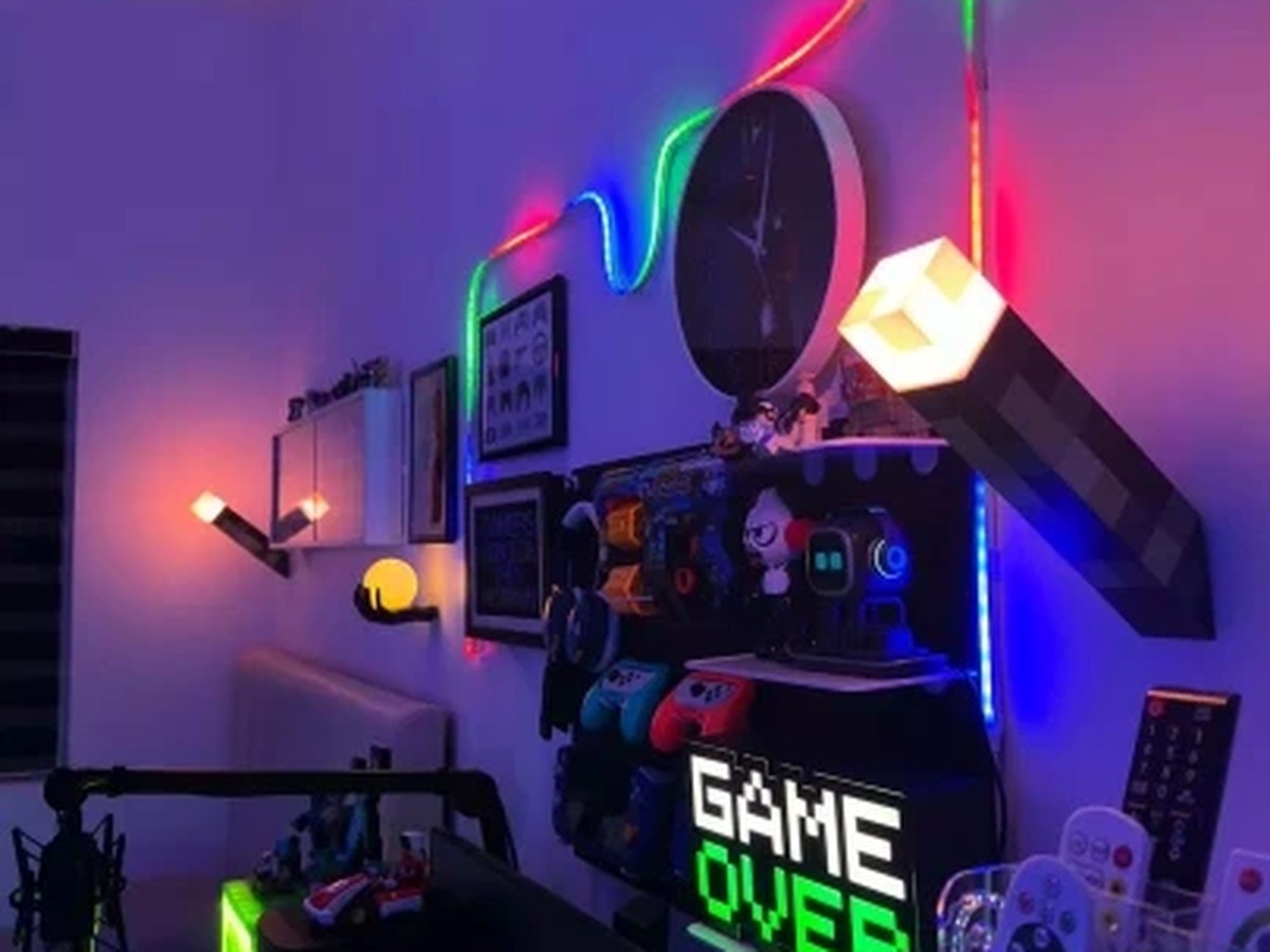 Pixel Torch Lamp mounted on a gaming room wall